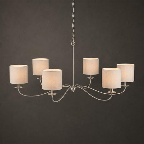 The satin nickel version fitted with six pale drum shades